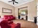 Entertainment room with large screen tv, built-in speakers and comfortable red reclining chairs at 1526 Bluewater Run, Chuluota, FL 32766