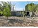 Backyard featuring a mix of greenery and sandy areas at 1656 Brentlawn St, Deltona, FL 32725
