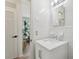 Bright bathroom featuring white tile walls and a modern vanity with marble countertop at 1656 Brentlawn St, Deltona, FL 32725