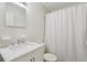 Clean bathroom featuring white tile, a shower, and modern fixtures at 1656 Brentlawn St, Deltona, FL 32725