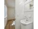 Clean, bright bathroom featuring white tiles and a modern sink at 1656 Brentlawn St, Deltona, FL 32725