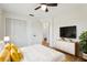 Bright bedroom featuring modern decor and an adjoining bathroom at 1656 Brentlawn St, Deltona, FL 32725