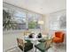 Sunlit breakfast nook with modern furniture and a view of the lush backyard at 1656 Brentlawn St, Deltona, FL 32725