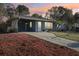 Charming single-story home with a well-manicured lawn, blue paint, and a cozy front porch at 1656 Brentlawn St, Deltona, FL 32725