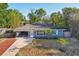 Charming home with a well-maintained front yard and covered carport at 1656 Brentlawn St, Deltona, FL 32725