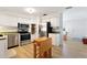 Well-lit kitchen with stainless steel appliances and convenient moveable island at 1656 Brentlawn St, Deltona, FL 32725