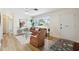 Bright living room with lots of natural light, modern flooring and stylish furniture at 1656 Brentlawn St, Deltona, FL 32725