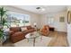 Cozy living room with large window, comfortable sofa, and ample natural light at 1656 Brentlawn St, Deltona, FL 32725