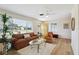 Bright living room with lots of natural light, modern flooring and stylish furniture at 1656 Brentlawn St, Deltona, FL 32725