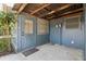 Covered patio area featuring a door and windows for natural light at 1656 Brentlawn St, Deltona, FL 32725