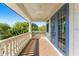 Spacious balcony featuring classic railings, tiled flooring, and blue french doors that provide lots of natural light at 1665 Temple Dr, Winter Park, FL 32789