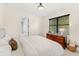Relaxing bedroom with a neutral palette, dresser with decor, and a window for natural light at 1665 Temple Dr, Winter Park, FL 32789
