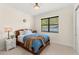 Charming bedroom with a wood bed frame, a window, and a view of the outside at 1665 Temple Dr, Winter Park, FL 32789