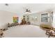 Spacious bonus room with natural lighting, and decorative rainbows and toys, ideal for Gathering activities at 1665 Temple Dr, Winter Park, FL 32789
