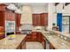 This gourmet kitchen features custom cabinets, granite counters, and modern stainless steel appliances at 1665 Temple Dr, Winter Park, FL 32789