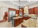 Gourmet kitchen with granite countertops, stainless steel appliances, and a large island at 1665 Temple Dr, Winter Park, FL 32789