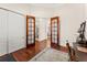 Spacious office with french doors, wood floors, and an adjacent bathroom and dining room at 1665 Temple Dr, Winter Park, FL 32789