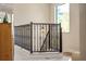 Staircase with wrought iron banister and a window with a view to the outside at 1665 Temple Dr, Winter Park, FL 32789