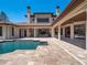 Gorgeous backyard featuring a large pool, covered patio, lush landscaping, and ample space for outdoor activities at 16812 Vinci Way, Bella Collina, FL 34756