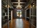 Sophisticated home office with coffered ceilings, built-in bookshelves, and a large window offering natural light at 16812 Vinci Way, Bella Collina, FL 34756