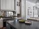 Bright kitchen features sleek countertops, stainless steel appliances, and custom cabinets at 16812 Vinci Way, Bella Collina, FL 34756
