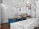 Bright kitchen featuring custom cabinets, marble countertops, two islands, and professional appliances at 16812 Vinci Way, Bella Collina, FL 34756