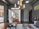 Chic living area offering a seamless transition through an entryway to another living room and powder room at 16812 Vinci Way, Bella Collina, FL 34756