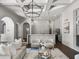 Open-concept living area connects seamlessly to a bright kitchen, perfect for modern living and entertaining at 16812 Vinci Way, Bella Collina, FL 34756