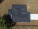 An overhead aerial view of the house shows a dark shingled roof and long, bright driveway at 1686 17Th St, Orange City, FL 32763