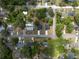 Bird's eye view of the house located in a quiet residential neighborhood with mature trees at 1686 17Th St, Orange City, FL 32763