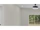 Bright living area features sliding glass doors opening to the fenced backyard at 1686 17Th St, Orange City, FL 32763