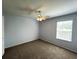 Well-lit room features neutral paint, plush carpeting, and bright light at 1831 Abbots Hill Dr, Orlando, FL 32835