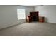Bedroom with plush carpeting, a wooden desk, and a window providing natural light at 1831 Abbots Hill Dr, Orlando, FL 32835