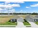 Charming single-Gathering homes with well-maintained lawns, gray exteriors, and two-car garages at 1963 Thompson Preserve Blvd, Bartow, FL 33830