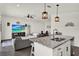 Bright and open-concept design of the kitchen, dining area, and living room creates an inviting space for modern living at 1963 Thompson Preserve Blvd, Bartow, FL 33830