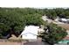 Aerial view of a single-Gathering home with mature trees and a serene atmosphere at 2132 Rouse Lake Rd, Orlando, FL 32817