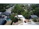 Aerial view of a single-Gathering home with a well-manicured front yard, driveway, and mature trees at 2132 Rouse Lake Rd, Orlando, FL 32817