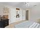 Neutral bedroom with tile floors and a queen bed next to a closet, TV, and decor at 2132 Rouse Lake Rd, Orlando, FL 32817