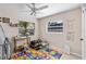 bedroom featuring a crib, colorful playmat and educational decor at 2132 Rouse Lake Rd, Orlando, FL 32817