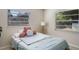 Bright bedroom with two windows that let in lots of natural light and a comfortable bed at 2132 Rouse Lake Rd, Orlando, FL 32817