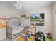 bedroom featuring a crib, toys, and educational decor at 2132 Rouse Lake Rd, Orlando, FL 32817