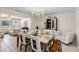 Dining room with seating for six guests with white leather and an open layout at 2132 Rouse Lake Rd, Orlando, FL 32817
