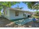 The backyard has mature trees providing shade and a patio accessible from the home at 2132 Rouse Lake Rd, Orlando, FL 32817