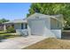 Charming single-story home with an attached garage and driveway at 2132 Rouse Lake Rd, Orlando, FL 32817