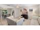 A bright and airy living room featuring modern white sofas and tile floors at 2132 Rouse Lake Rd, Orlando, FL 32817