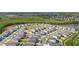 Bird's eye view of gray roofed homes in a Primary planned community and green forest preserve at 236 Pink Ibis Bnd, St Cloud, FL 34772