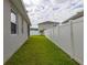 A well-maintained backyard and white vinyl fencing for privacy at 236 Pink Ibis Bnd, St Cloud, FL 34772