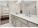 Bathroom featuring double sinks, granite countertops, and a glass door shower at 236 Pink Ibis Bnd, St Cloud, FL 34772