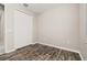 Bedroom with wood-look flooring, closet and large window at 236 Pink Ibis Bnd, St Cloud, FL 34772