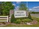 Estates at Southern Pines entrance sign with stone accents and manicured landscaping at 236 Pink Ibis Bnd, St Cloud, FL 34772